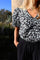 Siona V-Ausschnitt Bluse | Schwarze Blume | Bluse von Liberté